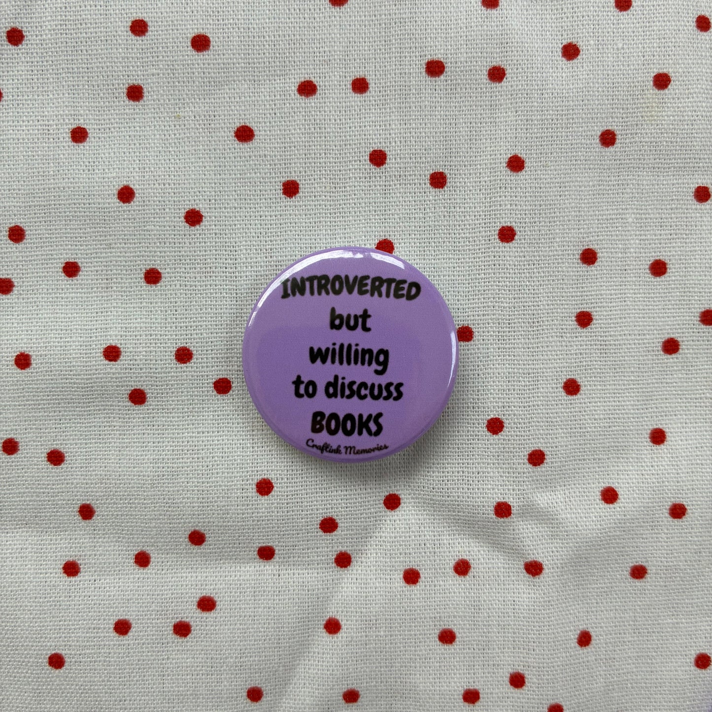 Button pin "Introverted but willing to discuss books"